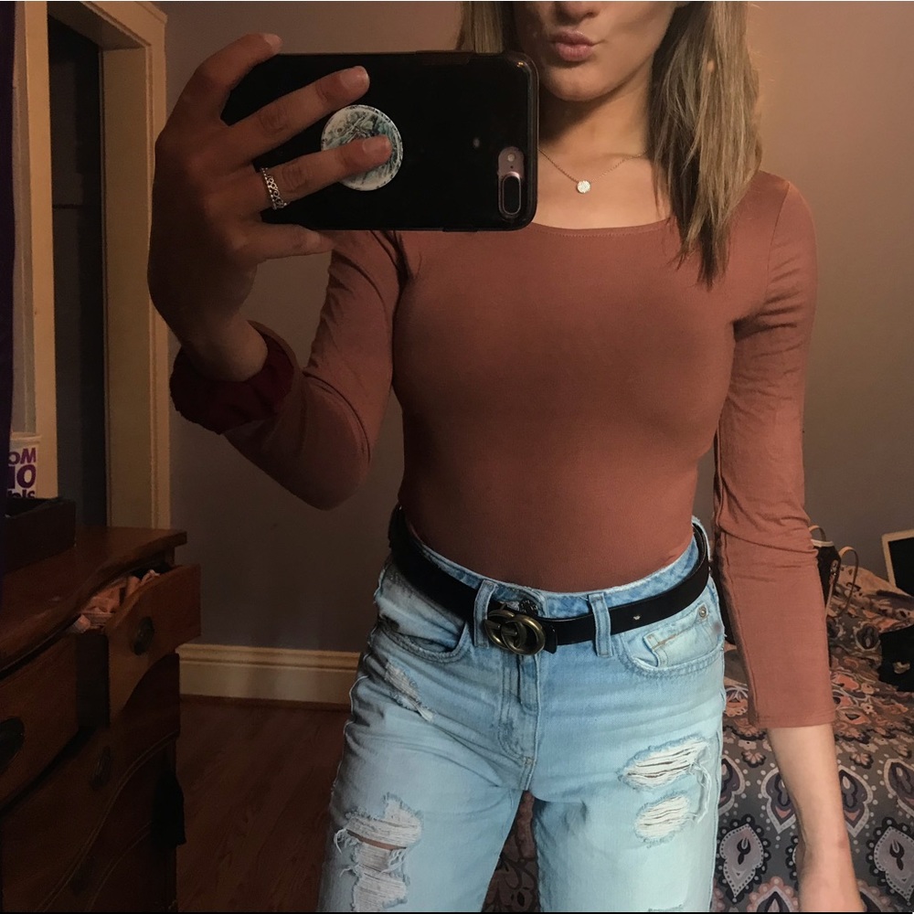 Mauve colored body suit